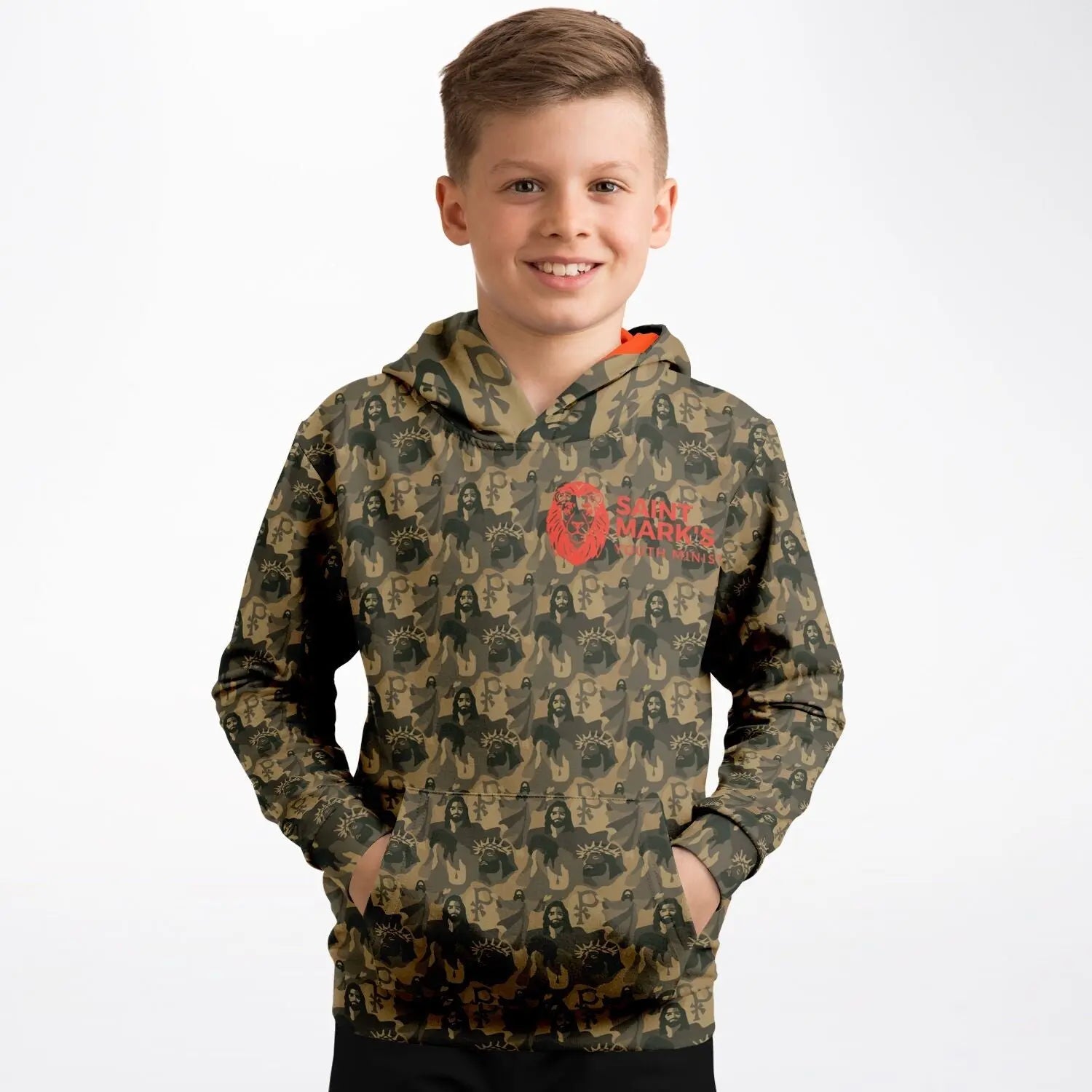 Image of a boy wearing a jesus camouflage hoodie with a logo of an orange lion and text that reads St Marks Youth Ministry